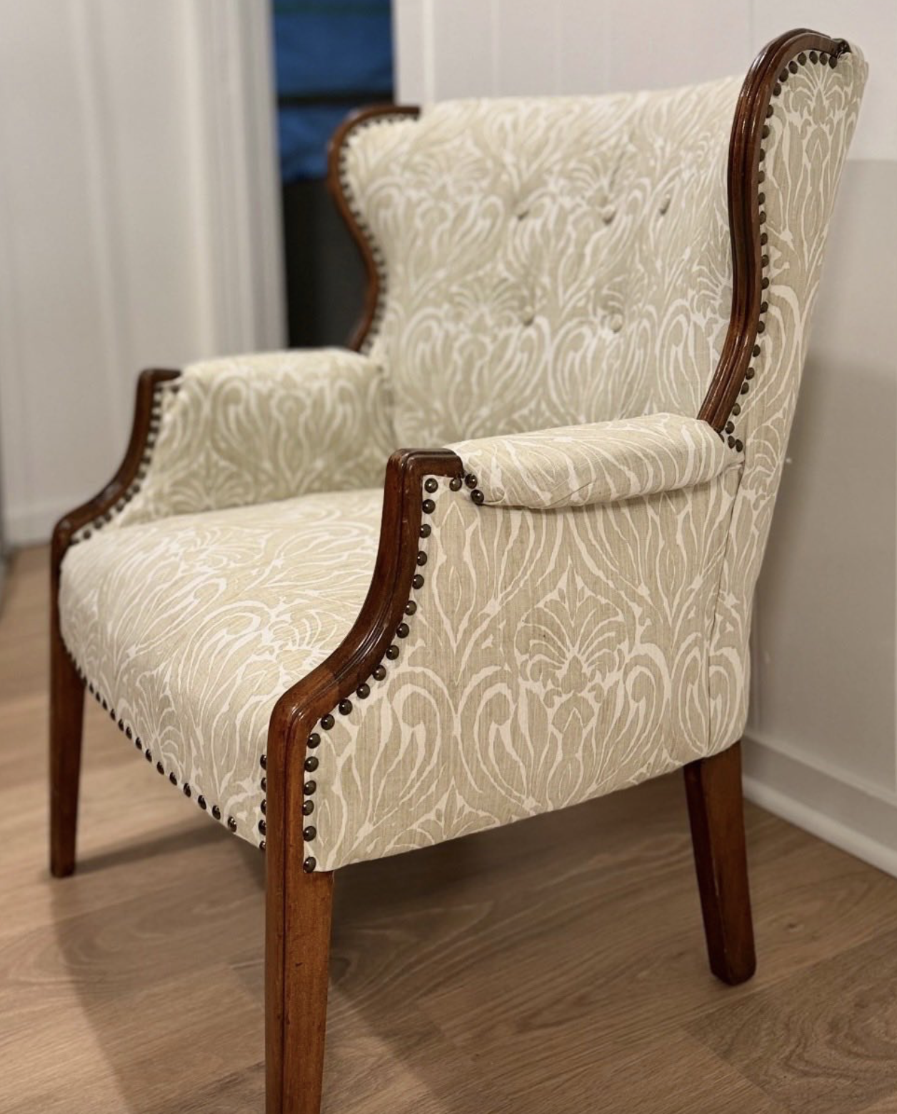 Restored wingback armchair in damask linen with nailhead trim